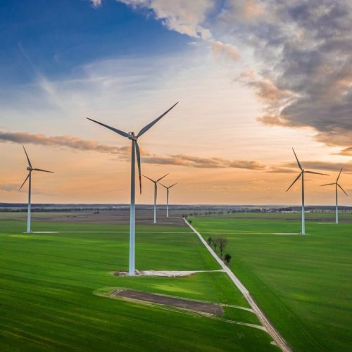 wind-turbines-at-dusk-on-green-field-renewable-energy-poland-.jpg